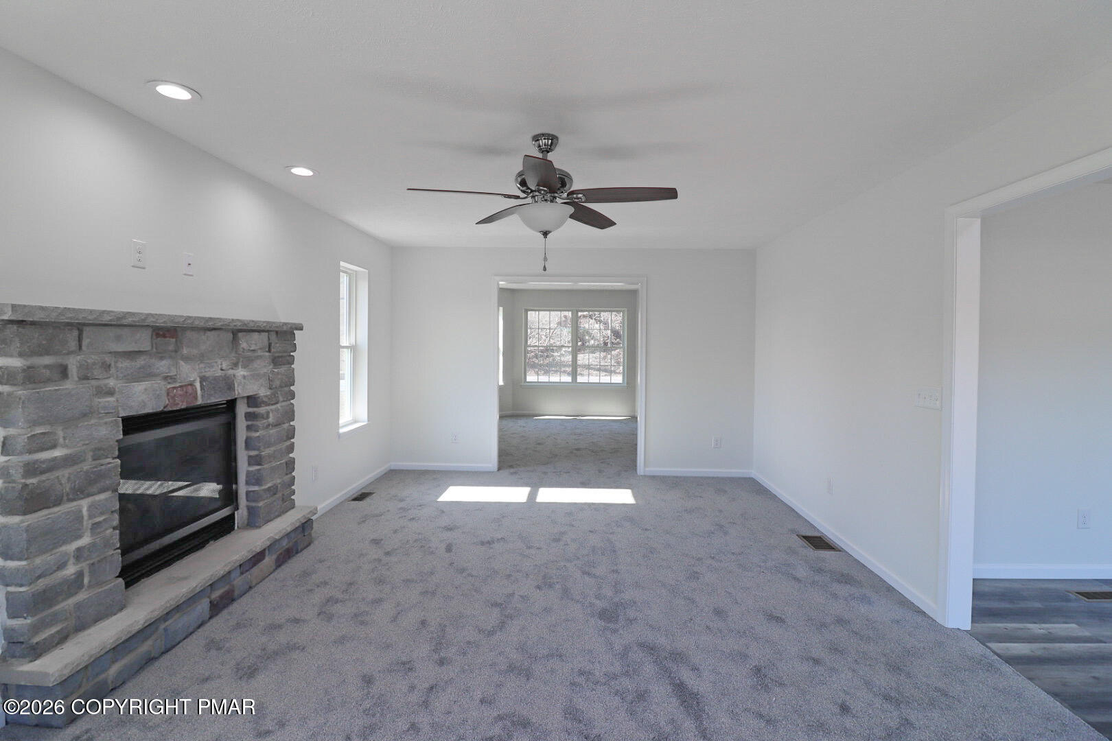 264 Mc Cole Road East Stroudsburg, PA 18302 - Photo 11 of 35 a view of an empty room with window and fireplace