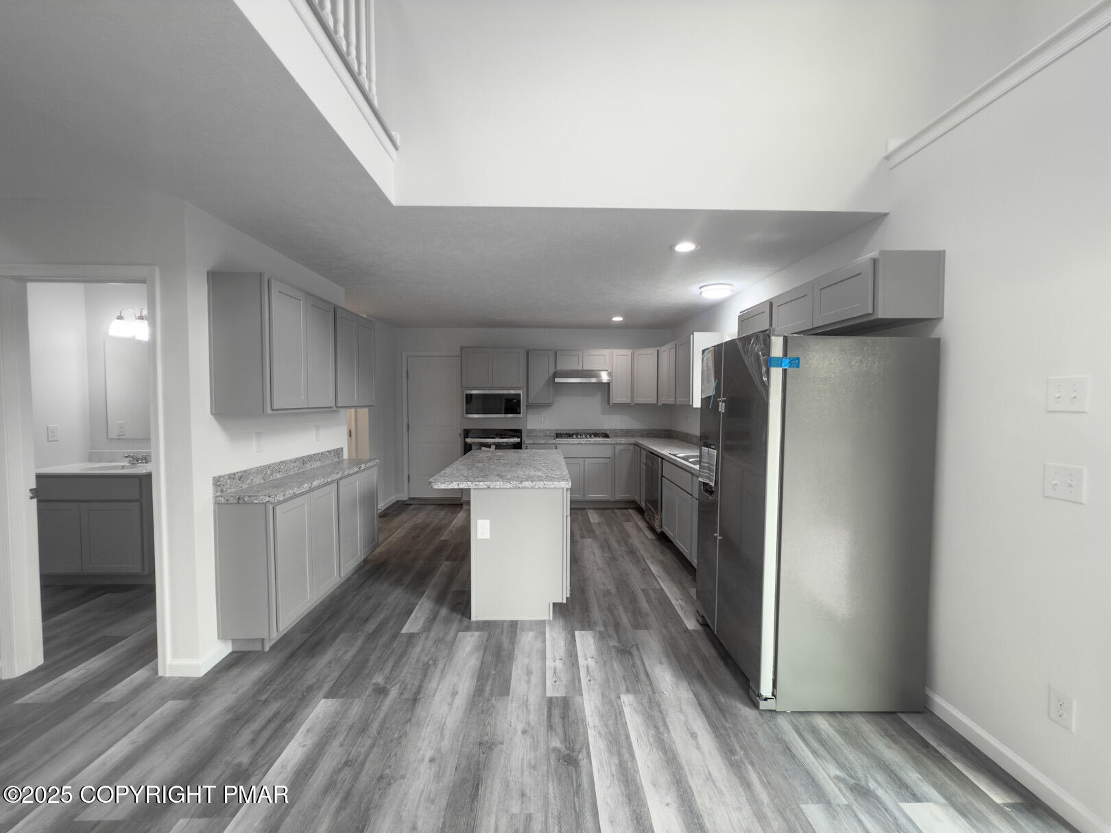 264 Mc Cole Road East Stroudsburg, PA 18302 - Photo 12 of 34 a kitchen with a refrigerator and white cabinets