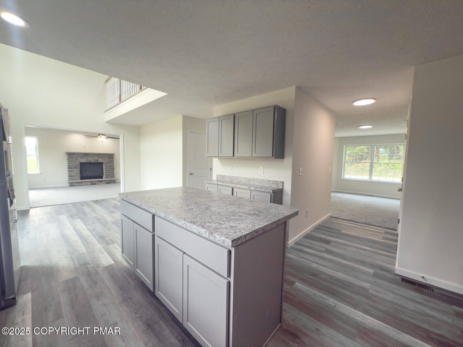 264 Mc Cole Road East Stroudsburg, PA 18302 - Photo 15 of 35 a kitchen with granite countertop a stove and a wooden floors