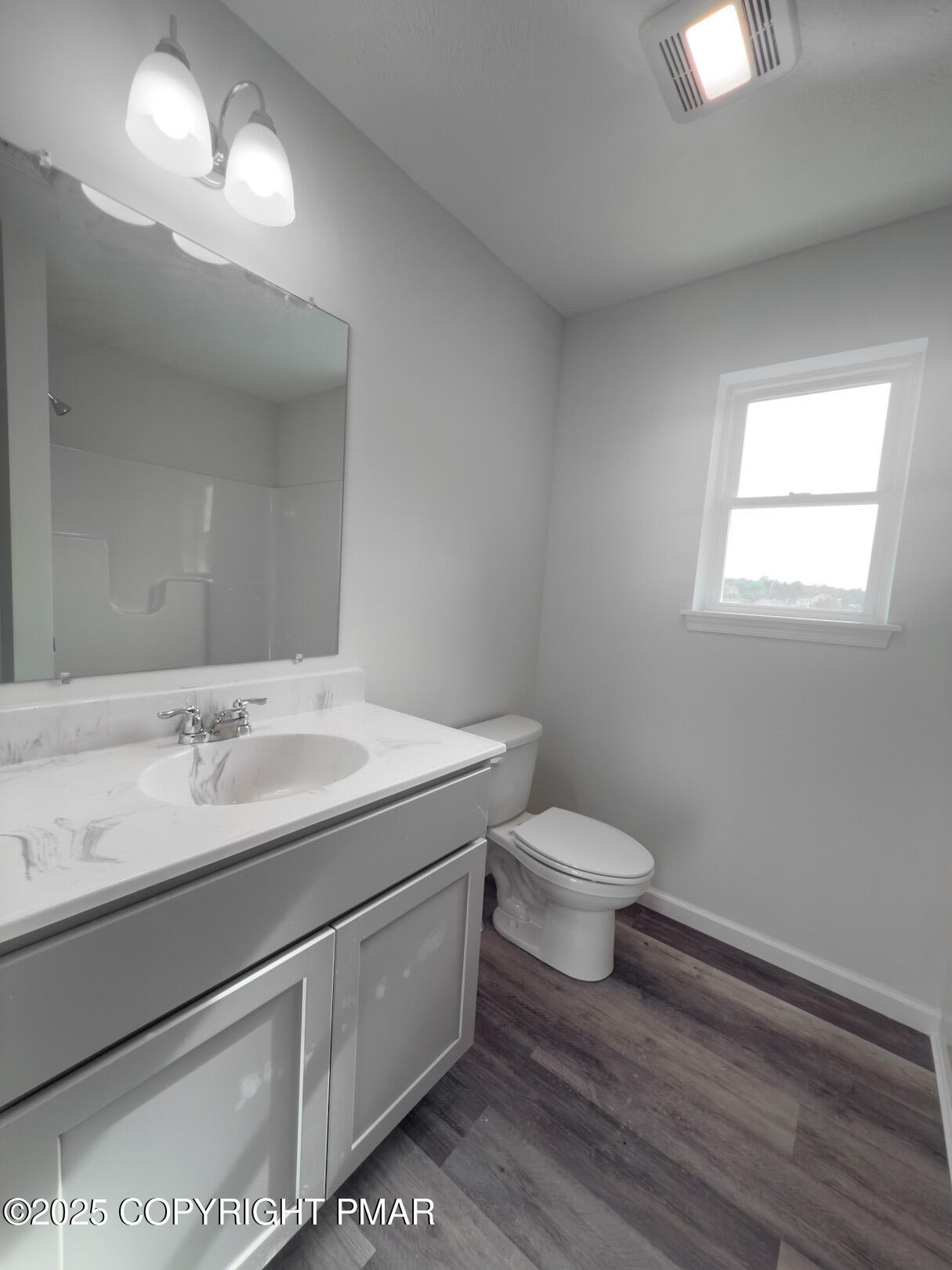 264 Mc Cole Road East Stroudsburg, PA 18302 - Photo 25 of 34 a bathroom with a toilet sink and mirror
