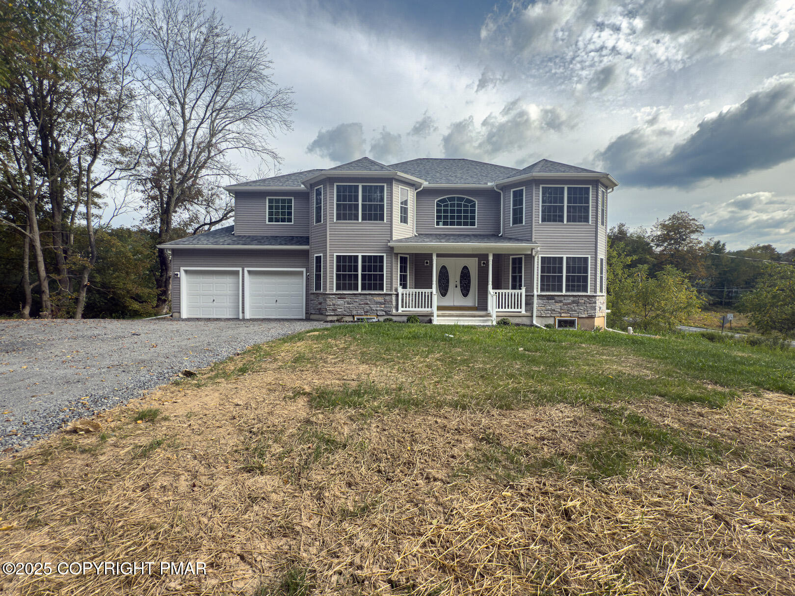 264 Mc Cole Road East Stroudsburg, PA 18302 - Photo 3 of 35 a front view of a house with garden