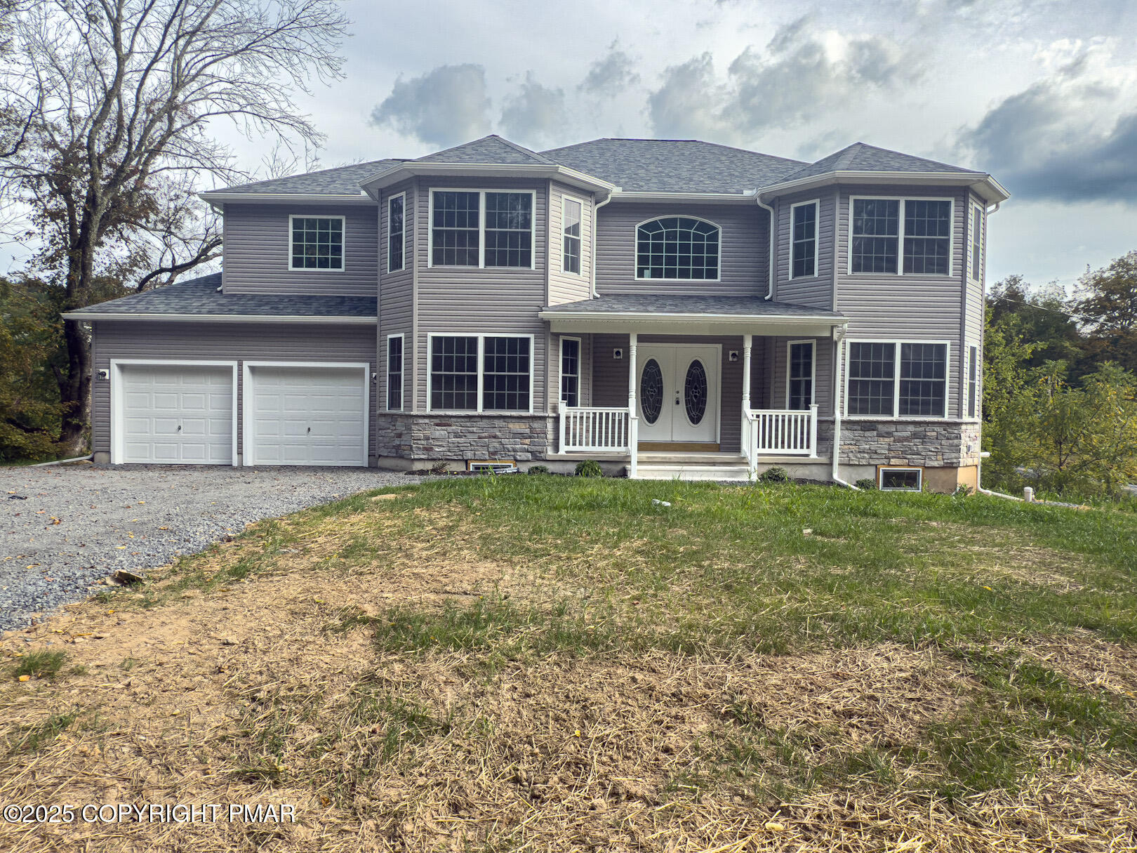 264 Mc Cole Road East Stroudsburg, PA 18302 - Photo 3 of 34 a front view of a house with a garden