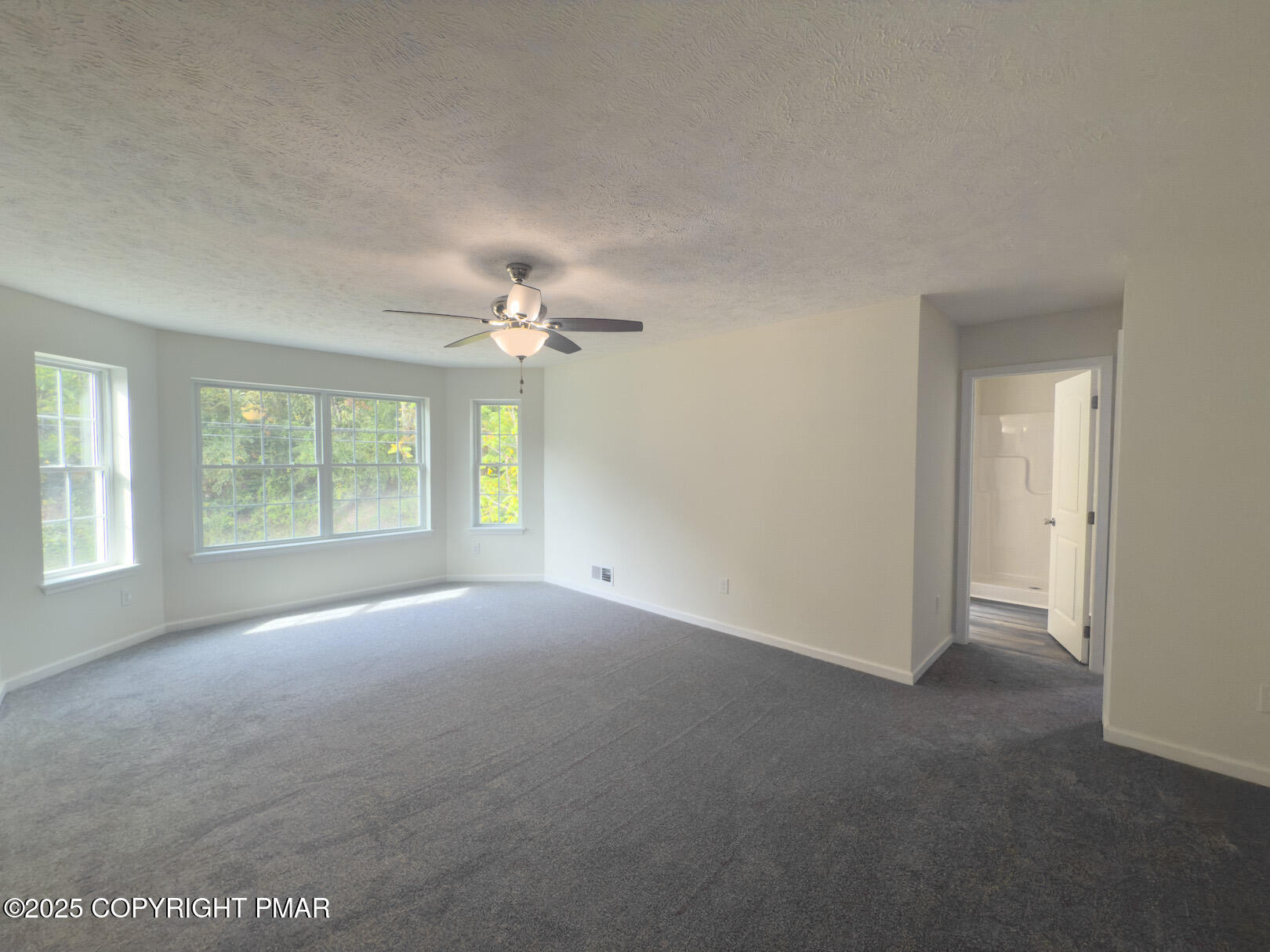 264 Mc Cole Road East Stroudsburg, PA 18302 - Photo 32 of 34 a view of a big room with windows and chandelier fan