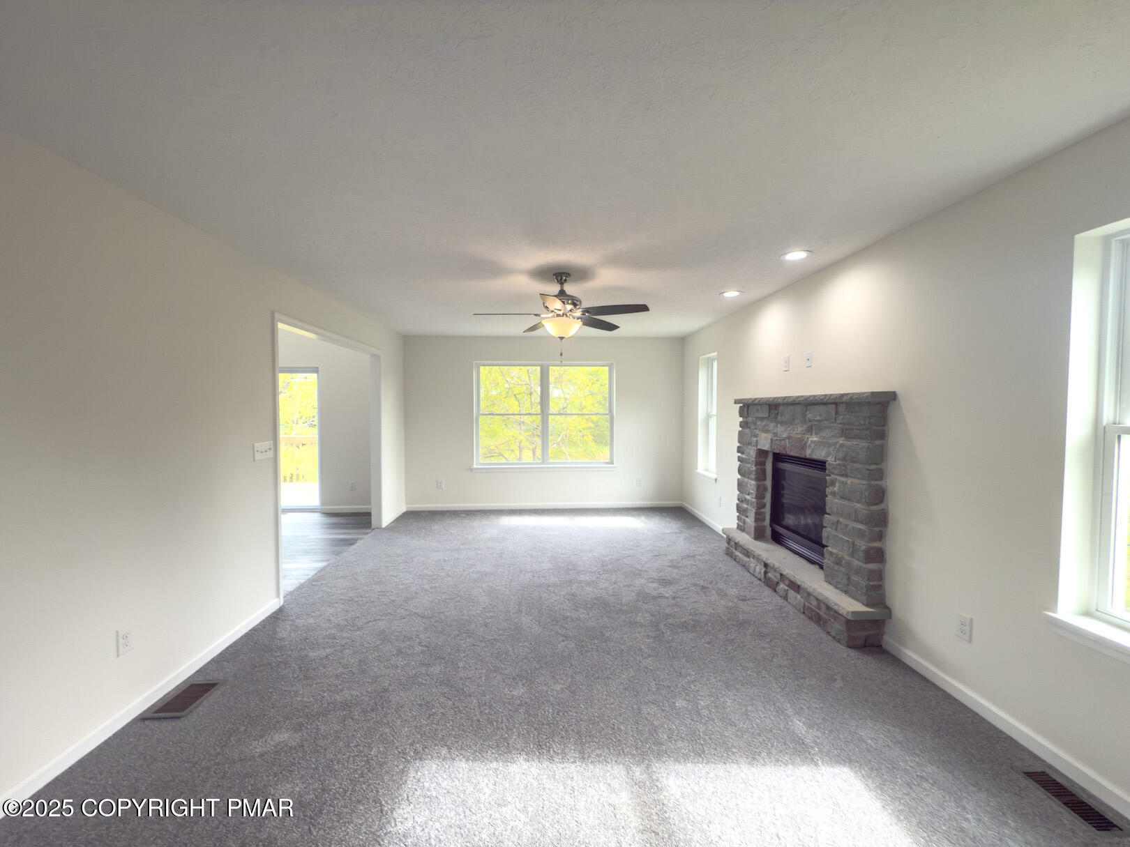 264 Mc Cole Road East Stroudsburg, PA 18302 - Photo 9 of 34 an empty room with windows and fireplace