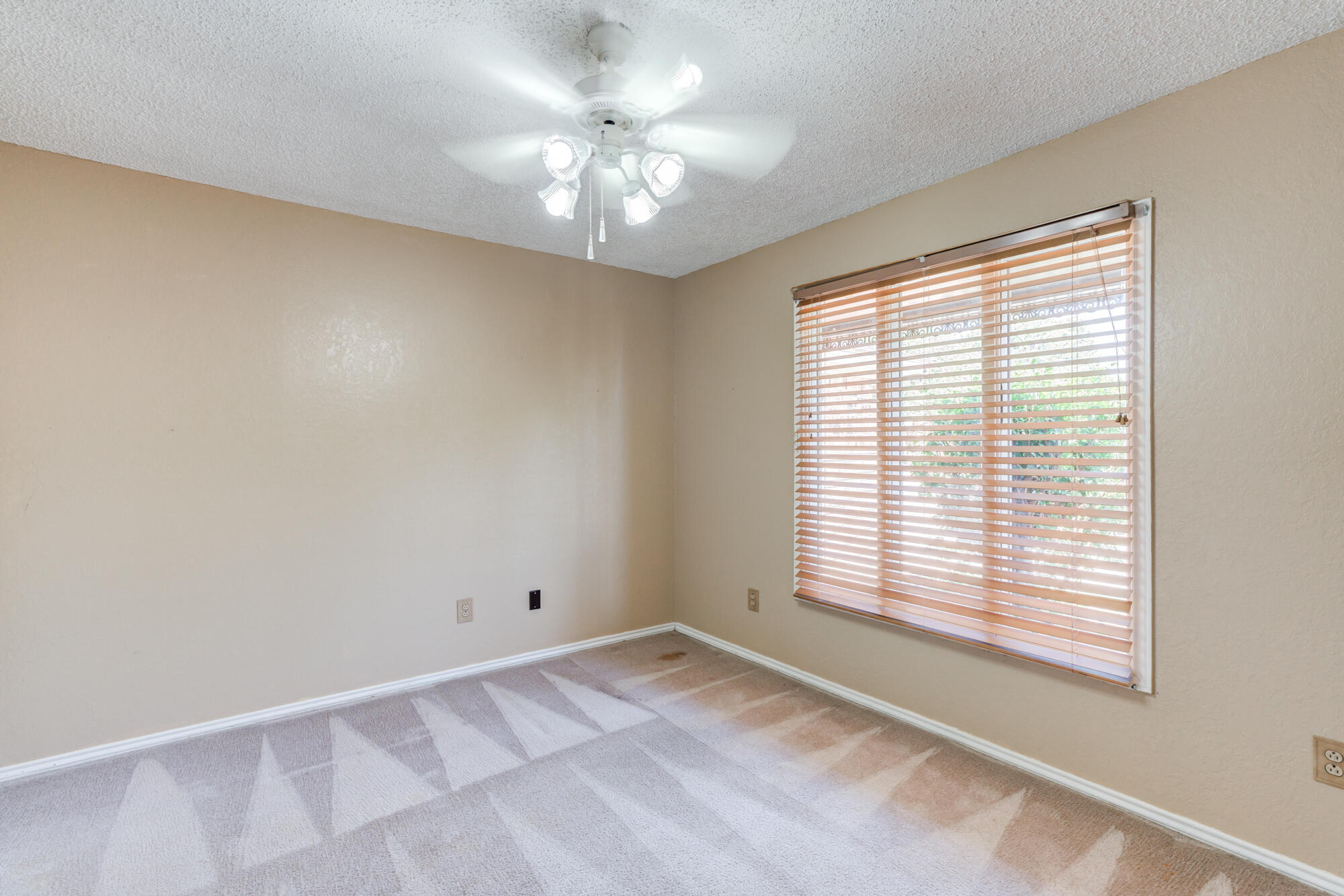 5523 74th Street Lubbock, TX 79424 - Photo 13 of 18 a view of an empty room with a window