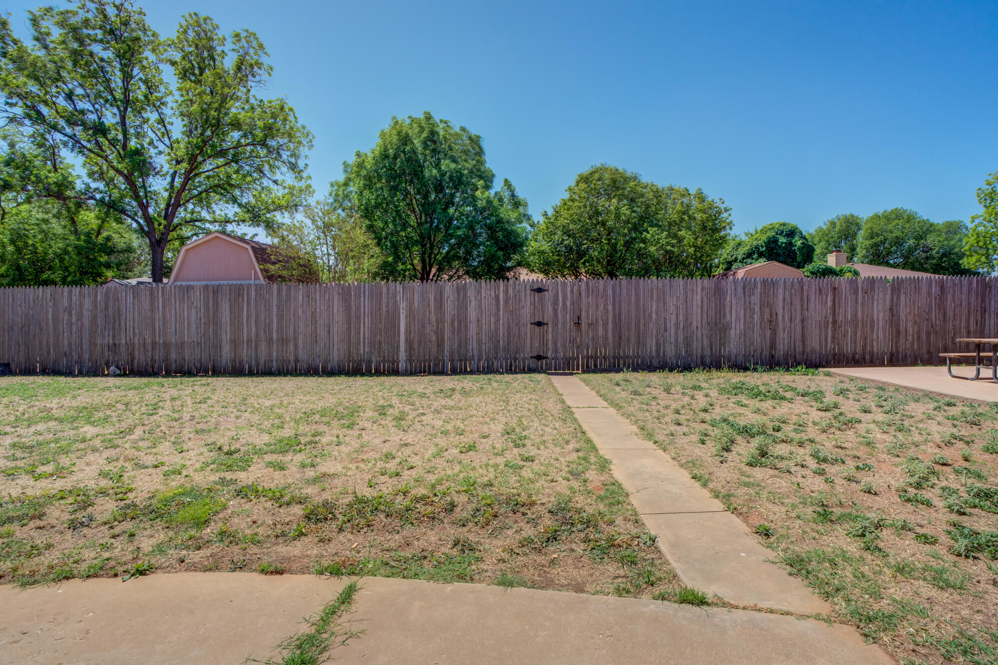 5523 74th Street Lubbock, TX 79424 - Photo 17 of 18 a view of wooden fence