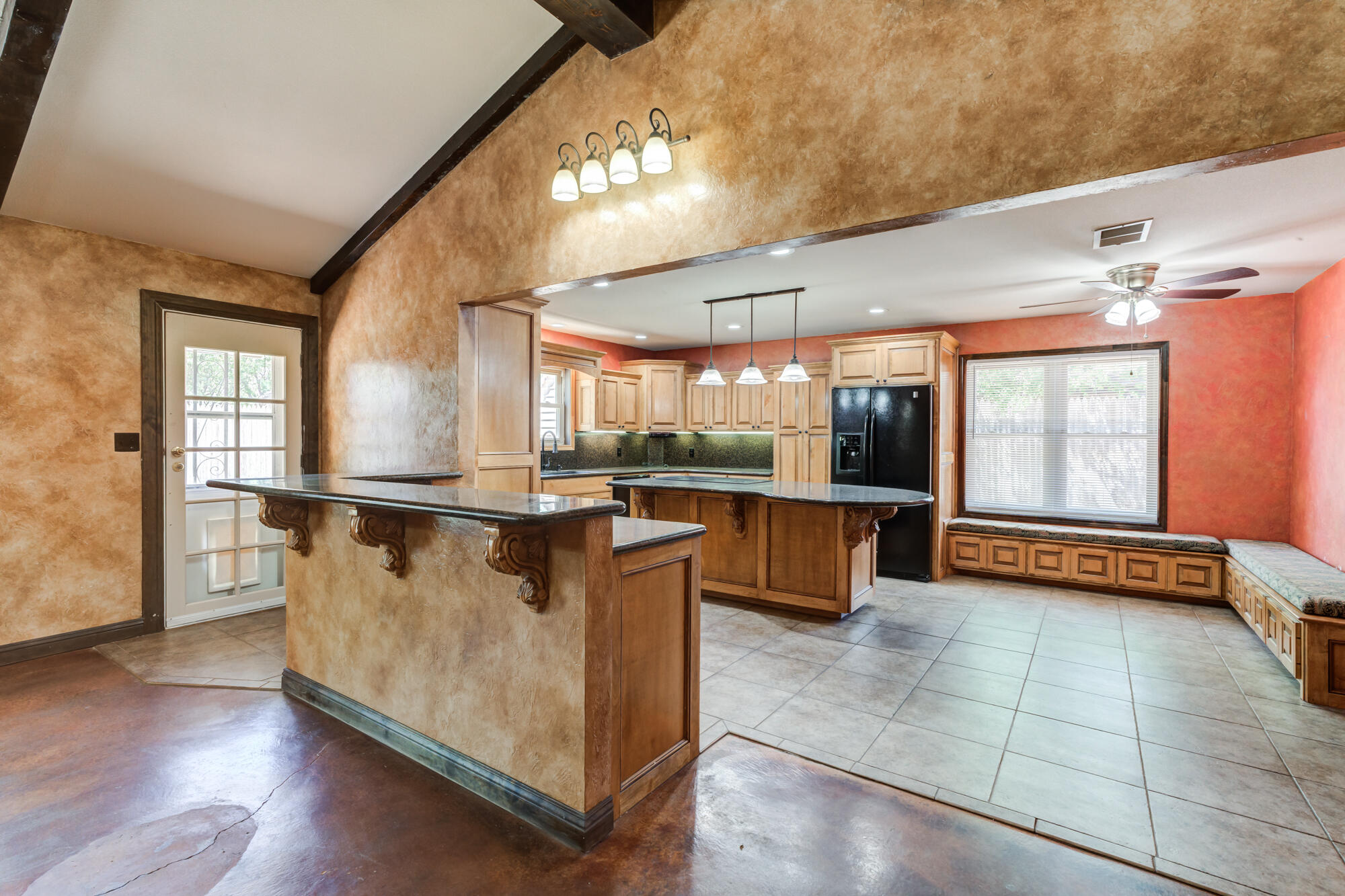 5523 74th Street Lubbock, TX 79424 - Photo 4 of 18 a view of kitchen with furniture and large windows