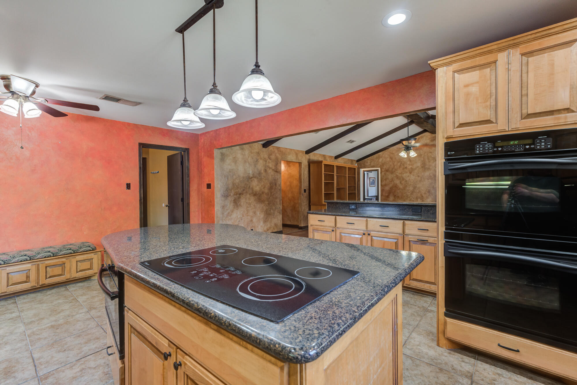 5523 74th Street Lubbock, TX 79424 - Photo 6 of 18 a kitchen with a stove and a microwave