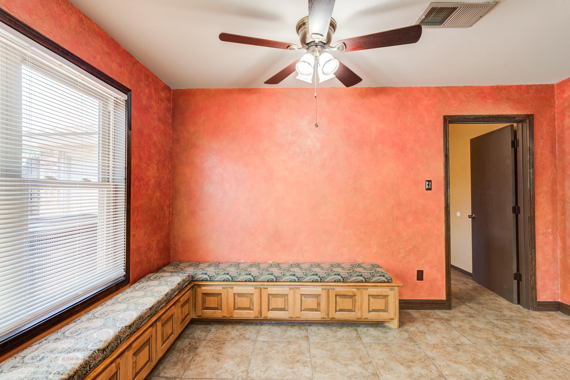 5523 74th Street Lubbock, TX 79424 - Photo 7 of 18 a room with a bed and a chandelier