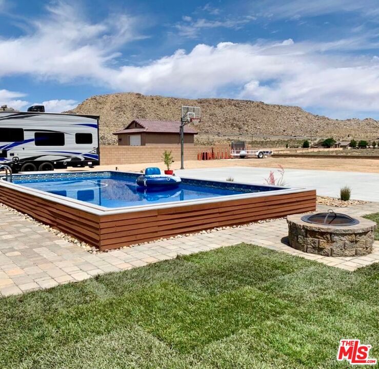 17794 Cabazon Road Apple Valley, CA 92307 - Photo 3 of 3 a view of a swimming pool with an ocean view