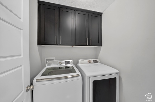 1081 Bowery Way Mapleton, UT 84664 - Photo 27 of 41 Dark-toned upper cabinetry with silver-tone hardware