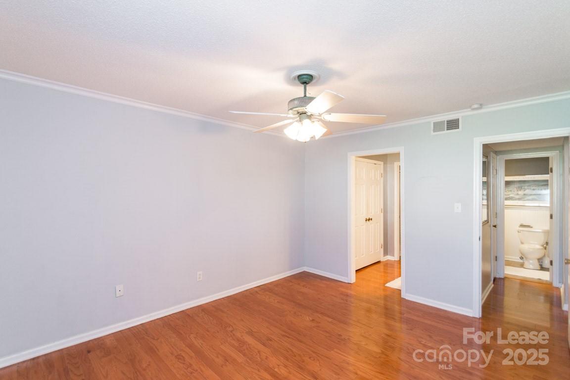 140 Lake Concord Road Northeast, Unit B4 Concord, NC 28025 - Photo 11 of 23 a view of an empty room with wooden floor