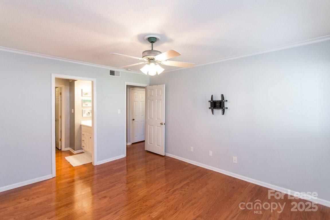 140 Lake Concord Road Northeast, Unit B4 Concord, NC 28025 - Photo 14 of 23 a view of an empty room with a fan