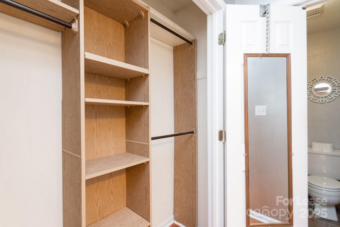 140 Lake Concord Road Northeast, Unit B4 Concord, NC 28025 - Photo 15 of 23 a view of walk in closet with empty racks