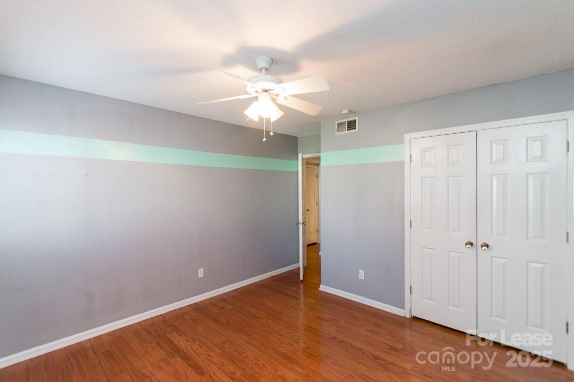140 Lake Concord Road Northeast, Unit B4 Concord, NC 28025 - Photo 18 of 23 wooden floor in an empty room