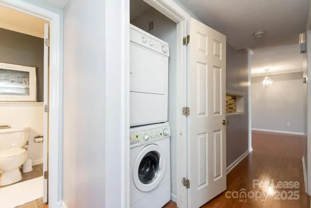 a view of a hallway with washer and dryer