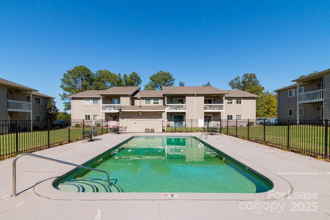 140 Lake Concord Road Northeast, Unit B4 Concord, NC 28025 - Photo 23 of 23 a view of a house with a swimming pool