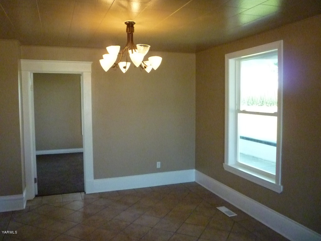 3020 Fort Road Toppenish, WA 98948 - Photo 15 of 37 a view of a chandelier fan and fire place