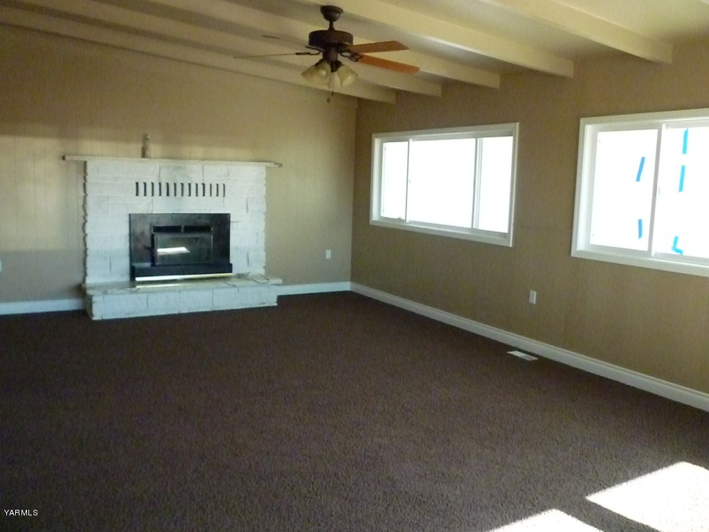 3020 Fort Road Toppenish, WA 98948 - Photo 24 of 37 a view of an empty room with a fireplace and a window