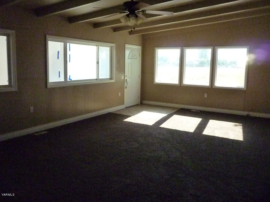 3020 Fort Road Toppenish, WA 98948 - Photo 26 of 37 a view of an empty room with wooden floor and windows