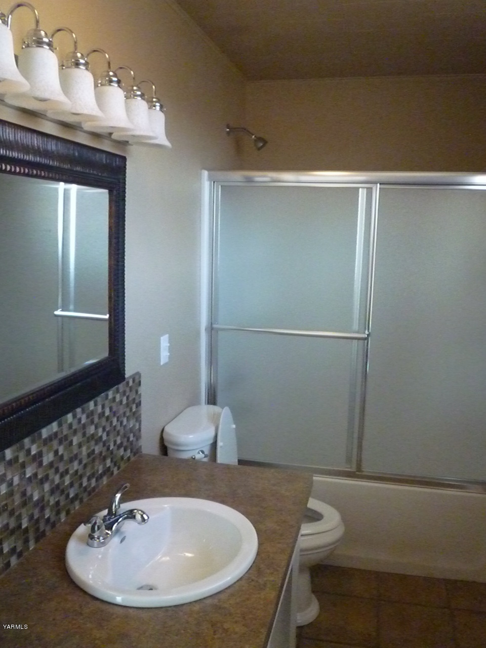 3020 Fort Road Toppenish, WA 98948 - Photo 34 of 37 a bathroom with a sink a toilet and mirror