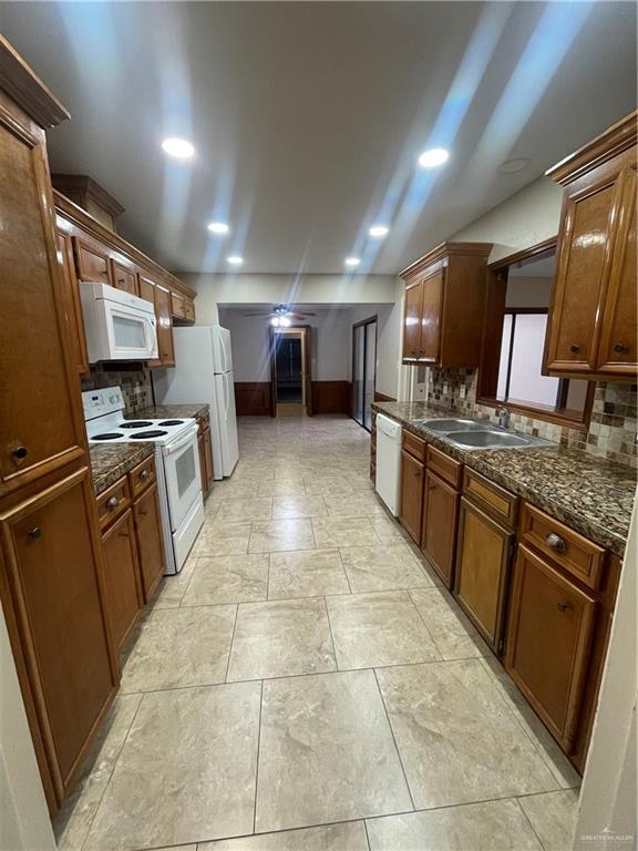 424 Toronto Avenue, Unit 31 McAllen, TX 78503 - Photo 3 of 14 Galley Kitchen with Fridge, Dishwasher, Stove, Microwave