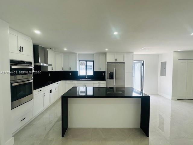 11870 Southwest 5th Street, Unit 1 Miami, FL 33184 - Photo 11 of 38 a large white kitchen with stainless steel appliances granite countertop a stove a refrigerator a sink and a oven