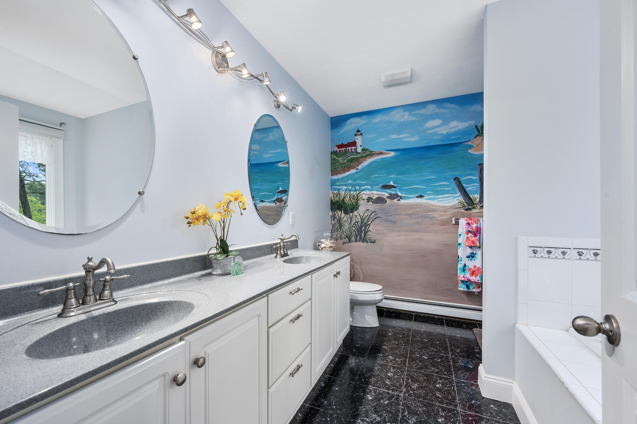 35 Bayshore Drive Mashpee, MA 02649 - Photo 19 of 55 a bathroom with a sink mirror vanity and toilet