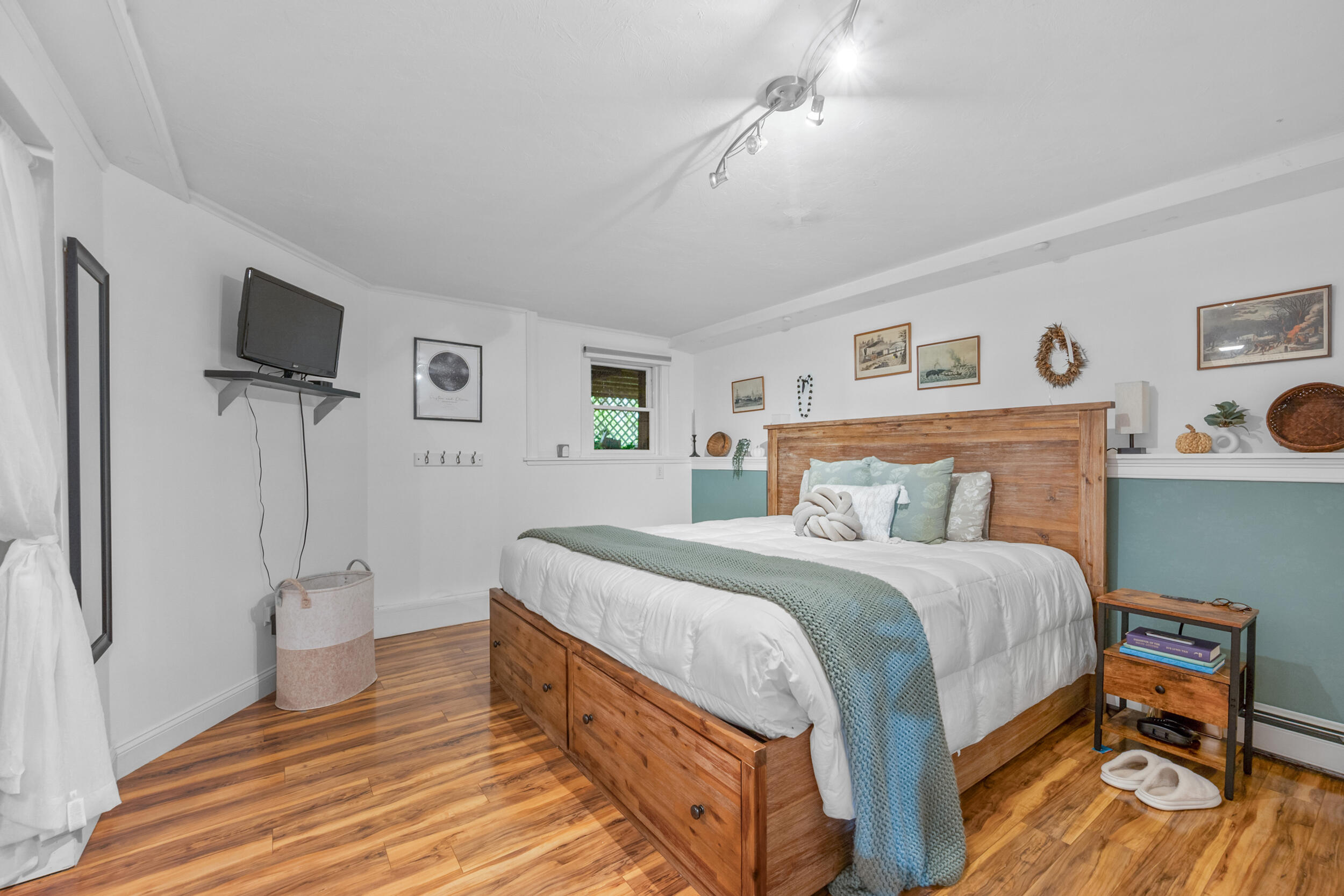 35 Bayshore Drive Mashpee, MA 02649 - Photo 32 of 55 a bedroom with a bed and a flat screen tv