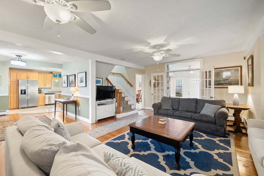 23 Oceanside Drive Scituate, MA 02066 - Photo 14 of 39 a living room with furniture and a flat screen tv