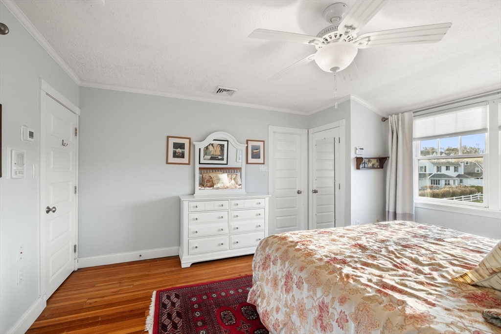 23 Oceanside Drive Scituate, MA 02066 - Photo 20 of 39 a spacious bedroom with a bed and a dresser