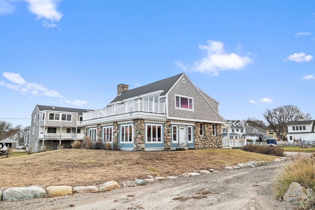 23 Oceanside Drive Scituate, MA 02066 - Photo 2 of 39 a front view of a house with a yard