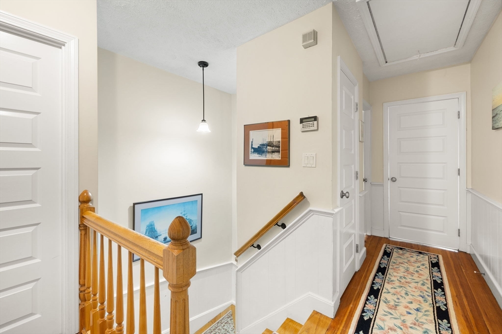 23 Oceanside Drive Scituate, MA 02066 - Photo 23 of 39 a view of an entryway with wooden floor