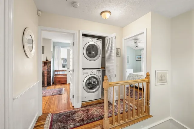 a view of a hallway with washer and dryer