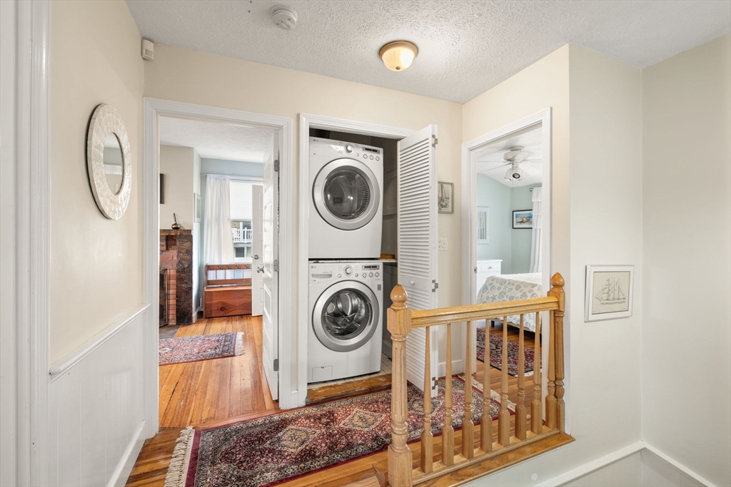 23 Oceanside Drive Scituate, MA 02066 - Photo 25 of 39 a view of a hallway with washer and dryer
