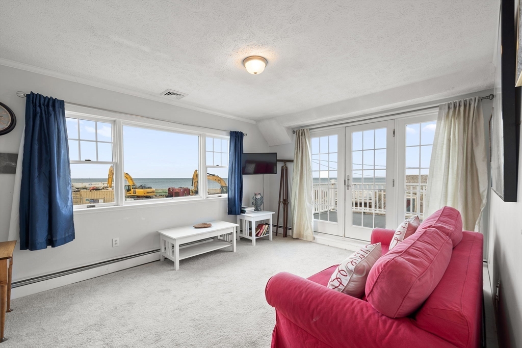 23 Oceanside Drive Scituate, MA 02066 - Photo 33 of 39 a living room with furniture and a large window