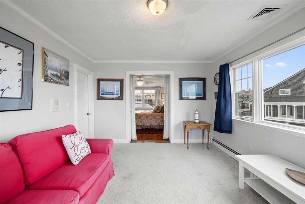 23 Oceanside Drive Scituate, MA 02066 - Photo 34 of 39 a living room with furniture and a fireplace