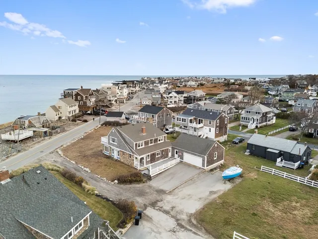 an aerial view of a house with a ocean view
