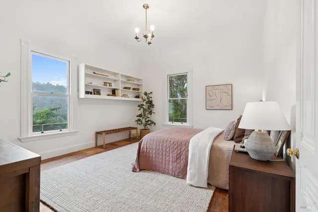 a spacious bedroom with a bed and window