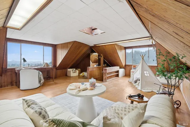 a living room with furniture and a table