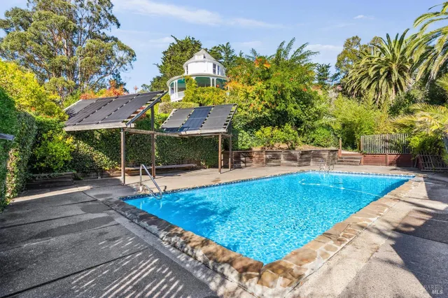 a view of a swimming pool with a patio