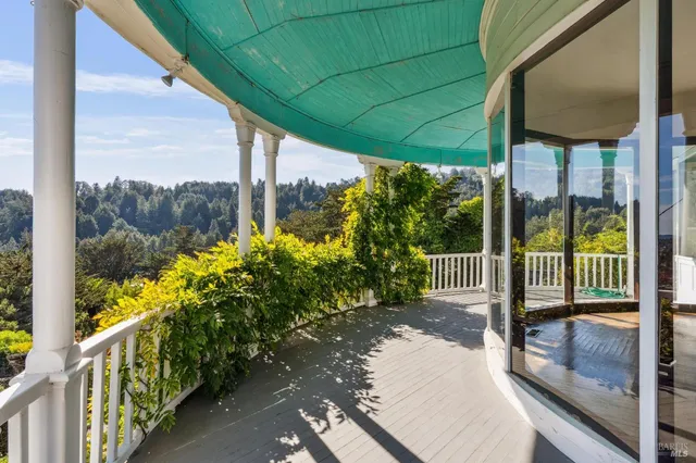 an aerial view of a house with yard swimming pool and outdoor seating