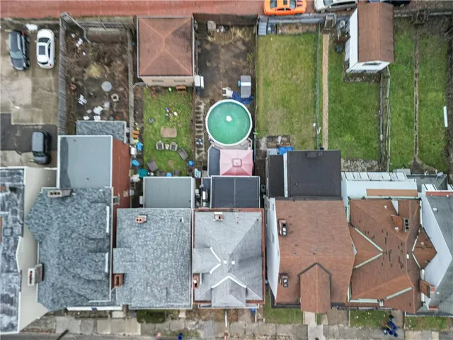 an aerial view of a house with a swimming pool