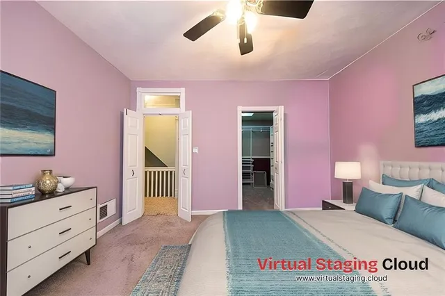 a spacious bedroom with a bed and a dresser in it