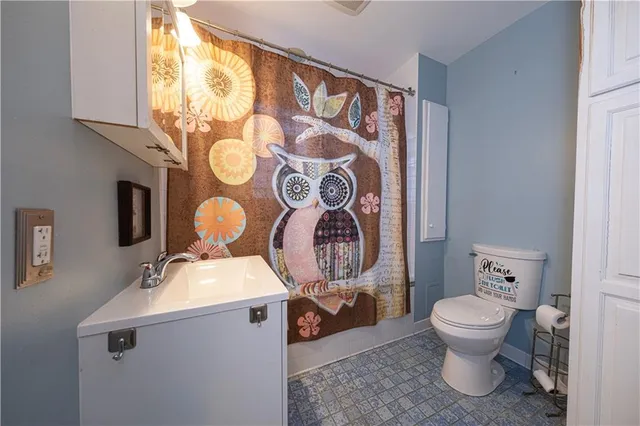 a bathroom with a toilet and a sink