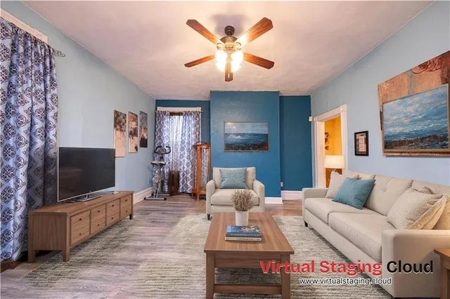 a living room with furniture and a flat screen tv