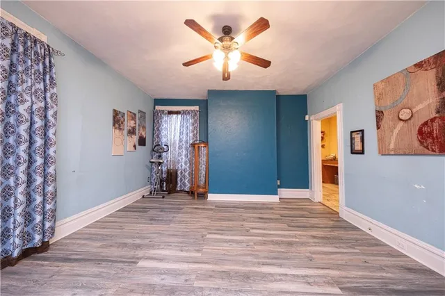 a view of livingroom with hardwood floor and a ceiling fan