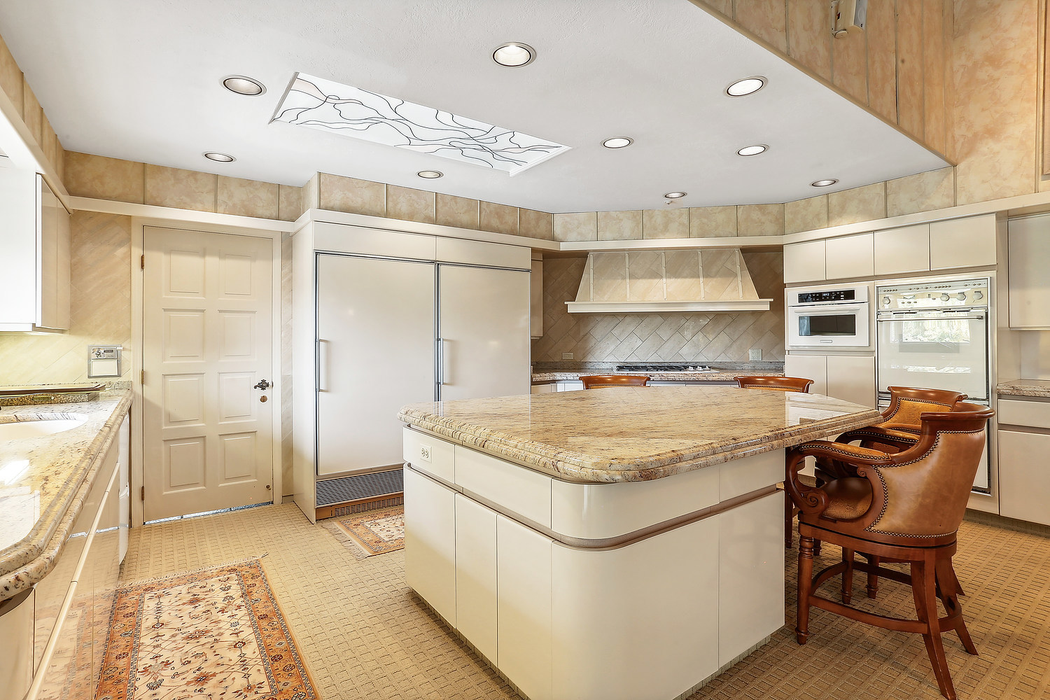 60 Baybrook Lane Oak Brook, IL 60523 - Photo 27 of 50 a kitchen with stainless steel appliances granite countertop a sink and a refrigerator