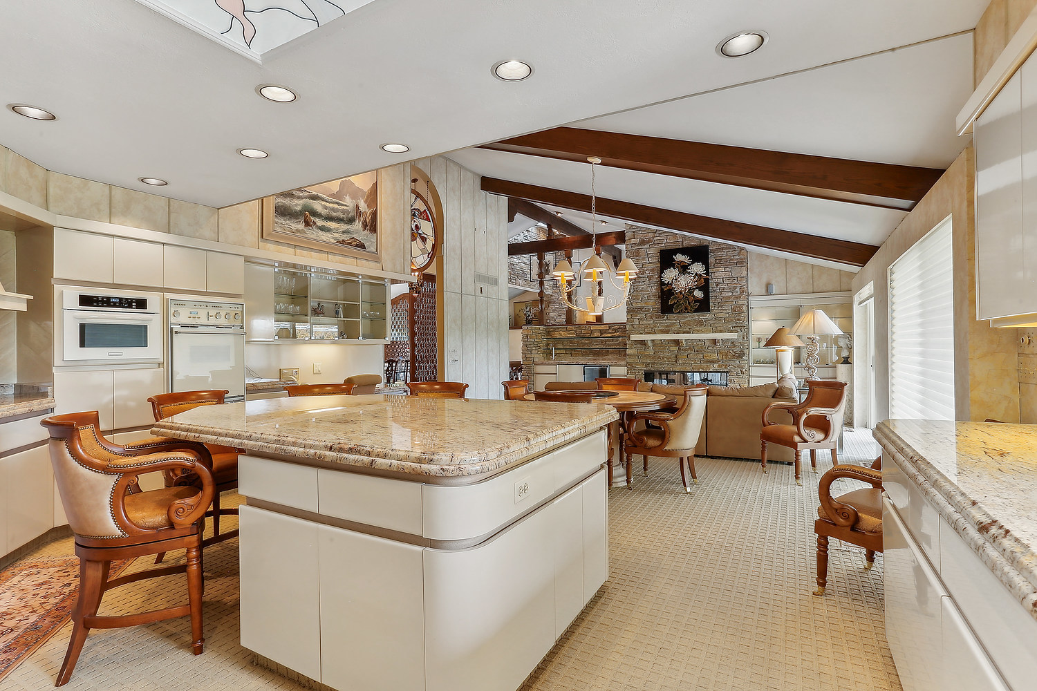 60 Baybrook Lane Oak Brook, IL 60523 - Photo 28 of 50 a dining hall with stainless steel appliances kitchen island granite countertop a table and chairs in it
