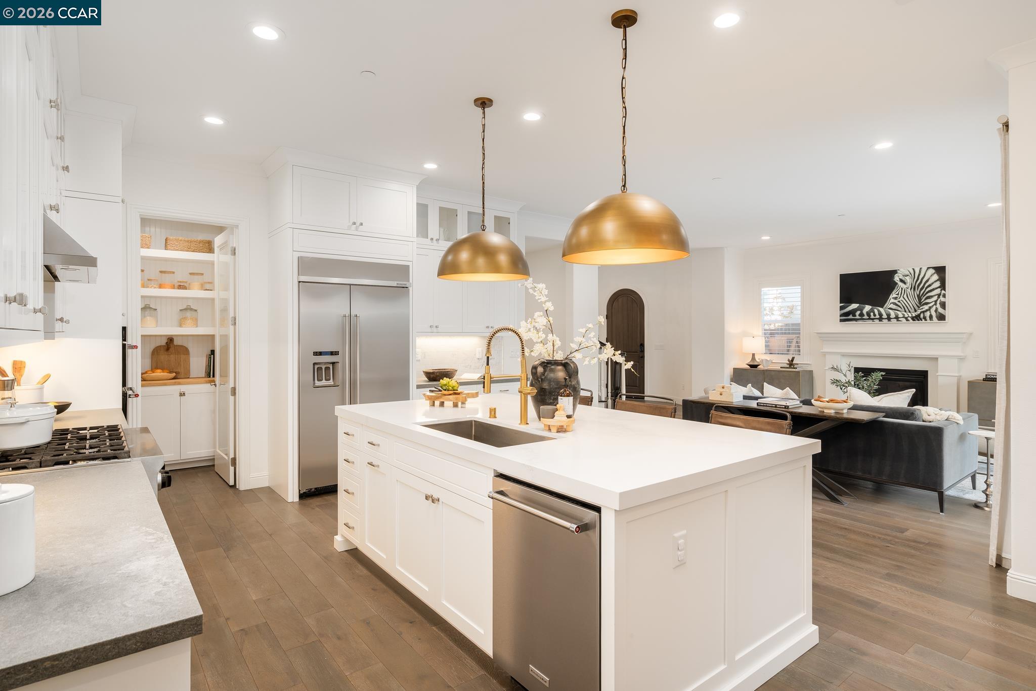 1150 Trumpet Vine Lane San Ramon, CA 94582 - Photo 13 of 45 a kitchen with a stove a refrigerator a sink and chairs